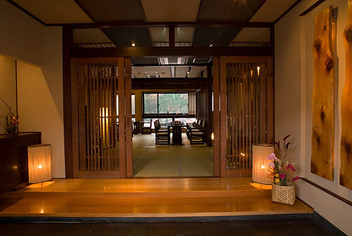 Interior of a traditional ryokan in Japan with timber flooring and doors
